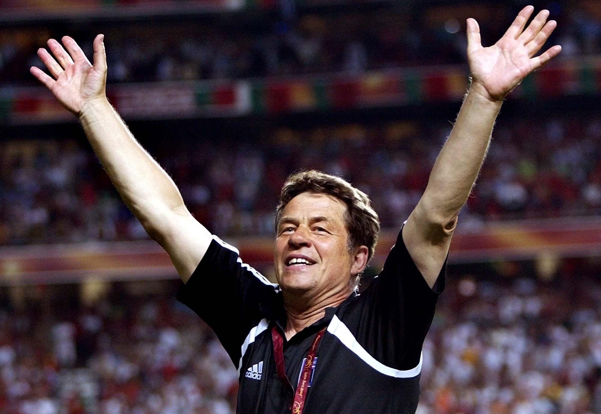 Greece soccer team coach Otto Rehhagel of Germany waves after Greece beat Portugal 1-0 in the Euro 2004 soccer championship final at the Luz stadium in Lisbon, Portugal, Sunday, July 4, 2004. (AP Photo/Steven Governo) **  FOR EDITORIAL USE ONLY NO WIRELESS COMMERCIAL OR PROMOTIONAL LICENSING PERMITTED  **